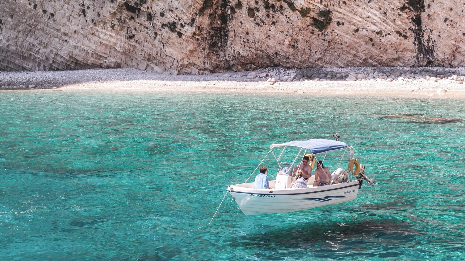 Boat trip in a turquoise cove in Salento